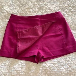 NWT!! Express skort. Never worn! Tags attached. Size 2. Magenta color.